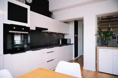 Kuchnia lub aneks kuchenny w obiekcie RentPlanet - Apartament Świętego Mikołaja