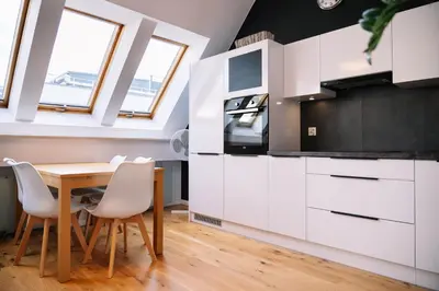 Kuchnia lub aneks kuchenny w obiekcie RentPlanet - Apartament Świętego Mikołaja