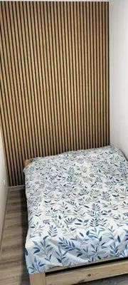 Łóżko lub łóżka w pokoju w obiekcie Kawalerka blisko GÓR