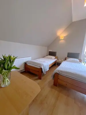 Łóżko lub łóżka w pokoju w obiekcie Dom noclegowy „POD MNICHEM”