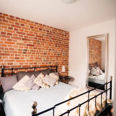 Łóżko lub łóżka w pokoju w obiekcie Pola Apartament Rodzinny