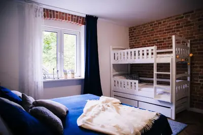 Łóżko lub łóżka w pokoju w obiekcie Pola Apartament Rodzinny