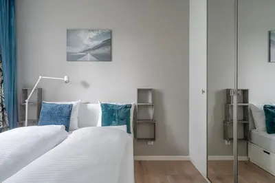 Łóżko lub łóżka w pokoju w obiekcie RentPlanet - Port Popowice