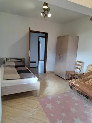 Łóżko lub łóżka w pokoju w obiekcie Ogrodowe Noclegi 2