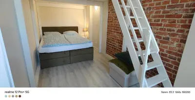 Łóżko lub łóżka w pokoju w obiekcie Apartament w Rynku