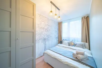 Łóżko lub łóżka w pokoju w obiekcie Apartament Garden Self check in 24h