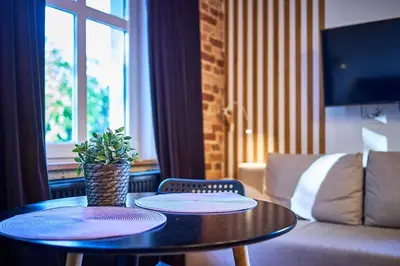 Telewizja i/lub zestaw kina domowego w obiekcie Marel-Apartament w parku Emma 6A Polanica Zdrój
