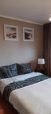 Łóżko lub łóżka w pokoju w obiekcie Apartament Tarnogórski