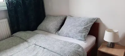 Łóżko lub łóżka w pokoju w obiekcie Apartament Tarnogórski