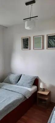 Łóżko lub łóżka w pokoju w obiekcie Apartament Tarnogórski