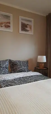 Łóżko lub łóżka w pokoju w obiekcie Apartament Tarnogórski