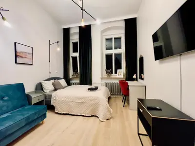 Telewizja i/lub zestaw kina domowego w obiekcie Spacious Apart in the Center- Main Square 300m