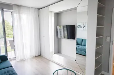 Część wypoczynkowa w obiekcie Apartament Pełen Wdzięku z balkonem