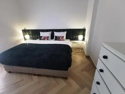 Łóżko lub łóżka w pokoju w obiekcie Apartament na Irysowej