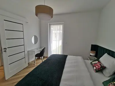 Łóżko lub łóżka w pokoju w obiekcie Apartament na Irysowej