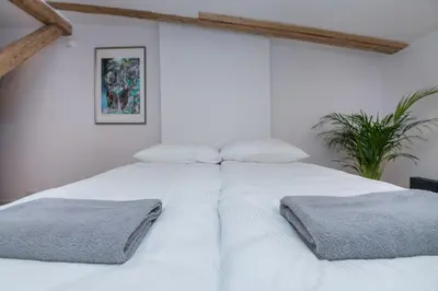 Łóżko lub łóżka w pokoju w obiekcie Apartament Ziemowita