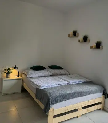 Łóżko lub łóżka w pokoju w obiekcie Mini Apartament Pod 13
