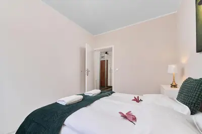 Łóżko lub łóżka w pokoju w obiekcie Apartment Na Szancach with Balcony by Noclegi Renters