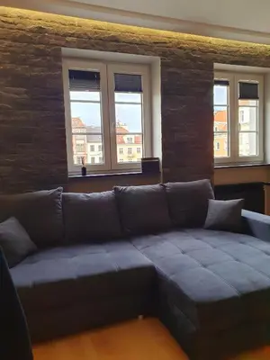 Część wypoczynkowa w obiekcie Rynek 23 LUX, apartament z widokiem na ratusz , parking free pod domem