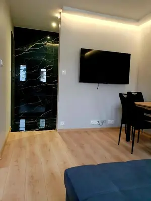 Telewizja i/lub zestaw kina domowego w obiekcie Rynek 23 LUX, apartament z widokiem na ratusz , parking free pod domem