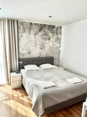 Łóżko lub łóżka w pokoju w obiekcie Apartament Kościuszki City Center by Apartamenty na dni Wrocław