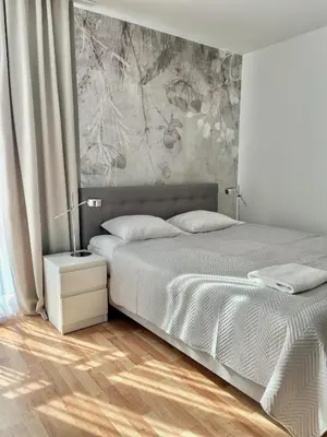 Łóżko lub łóżka w pokoju w obiekcie Apartament Kościuszki City Center by Apartamenty na dni Wrocław