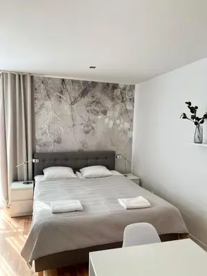 Łóżko lub łóżka w pokoju w obiekcie Apartament Kościuszki City Center by Apartamenty na dni Wrocław