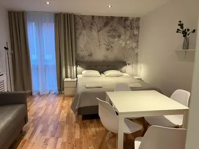 Łóżko lub łóżka w pokoju w obiekcie Apartament Kościuszki City Center by Apartamenty na dni Wrocław
