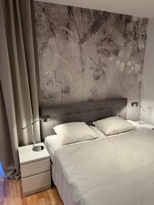 Łóżko lub łóżka w pokoju w obiekcie Apartament Kościuszki City Center by Apartamenty na dni Wrocław