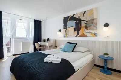Łóżko lub łóżka w pokoju w obiekcie Kairos Apartments - Loft - darmowy parking, ścisłe centrum