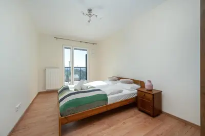 Łóżko lub łóżka w pokoju w obiekcie Wrocław 1-Bedroom Apartment with Parking & Balcony by Noclegi Renters