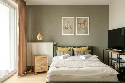 Łóżko lub łóżka w pokoju w obiekcie RentPlanet - Apartamenty Braniborska