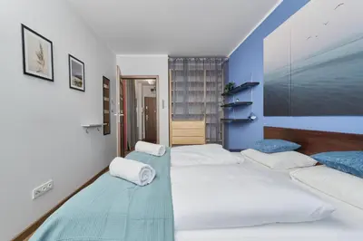 Łóżko lub łóżka w pokoju w obiekcie Apartament Drzewieckiego with Parking Wrocław by Noclegi Renters