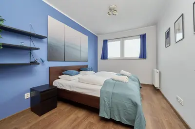 Łóżko lub łóżka w pokoju w obiekcie Apartament Drzewieckiego with Parking Wrocław by Noclegi Renters