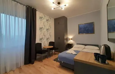 Łóżko lub łóżka w pokoju w obiekcie Trzy Kolory