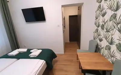 Łóżko lub łóżka w pokoju w obiekcie Trzy Kolory