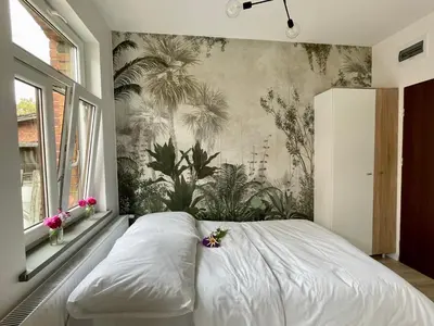 Łóżko lub łóżka w pokoju w obiekcie Studio Bielawa u podnóża Gór Sowich