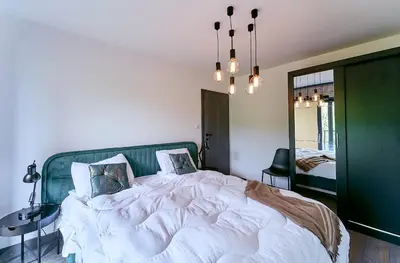 Łóżko lub łóżka w pokoju w obiekcie LAGUNA Ogrody Pieniawskie 38