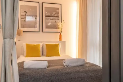 Łóżko lub łóżka w pokoju w obiekcie RentPlanet - Apartamenty Długa