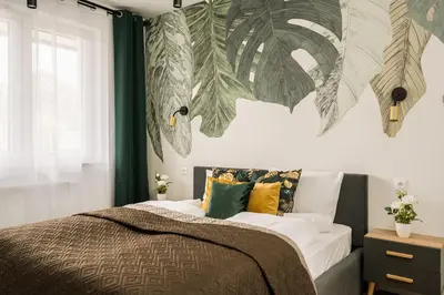 Łóżko lub łóżka w pokoju w obiekcie RentPlanet - Apartamenty Długa