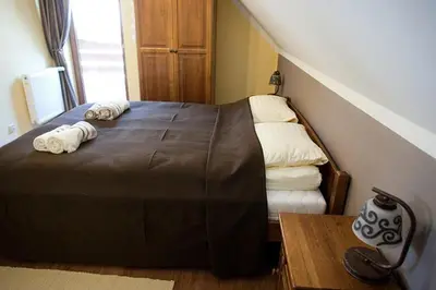 Łóżko lub łóżka w pokoju w obiekcie Chata Sudecka I apartamenty z aneksami kuchennymi
