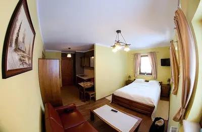 Łóżko lub łóżka w pokoju w obiekcie Chata Sudecka I apartamenty z aneksami kuchennymi