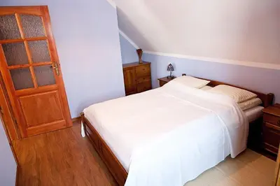 Łóżko lub łóżka w pokoju w obiekcie Chata Sudecka I apartamenty z aneksami kuchennymi