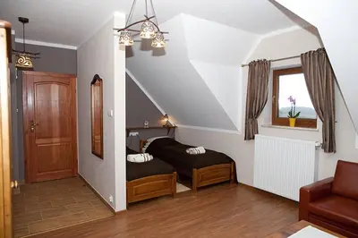 Łóżko lub łóżka w pokoju w obiekcie Chata Sudecka I apartamenty z aneksami kuchennymi