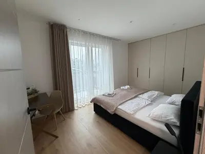 Łóżko lub łóżka w pokoju w obiekcie Duży Apartament 3 pokoje Park City