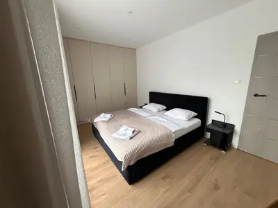 Łóżko lub łóżka w pokoju w obiekcie Duży Apartament 3 pokoje Park City