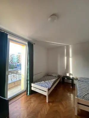 Łóżko lub łóżka w pokoju w obiekcie Apartament Celna
