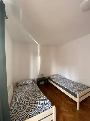 Łóżko lub łóżka w pokoju w obiekcie Apartament Celna