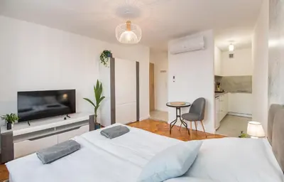 Łóżko lub łóżka w pokoju w obiekcie Apartament Dworcowa 24