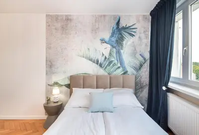 Łóżko lub łóżka w pokoju w obiekcie Apartament Dworcowa 24